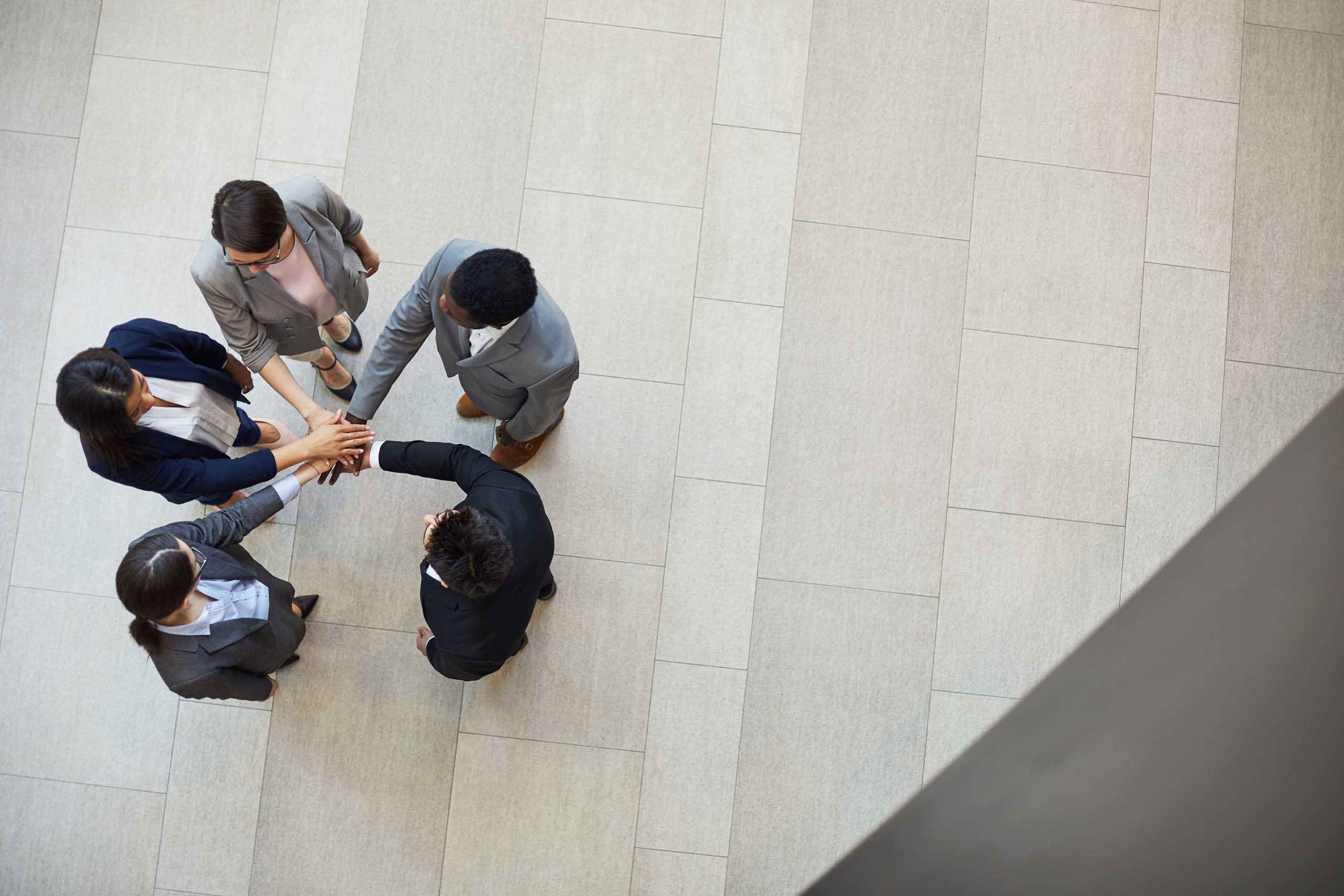 Business team stacking hands together